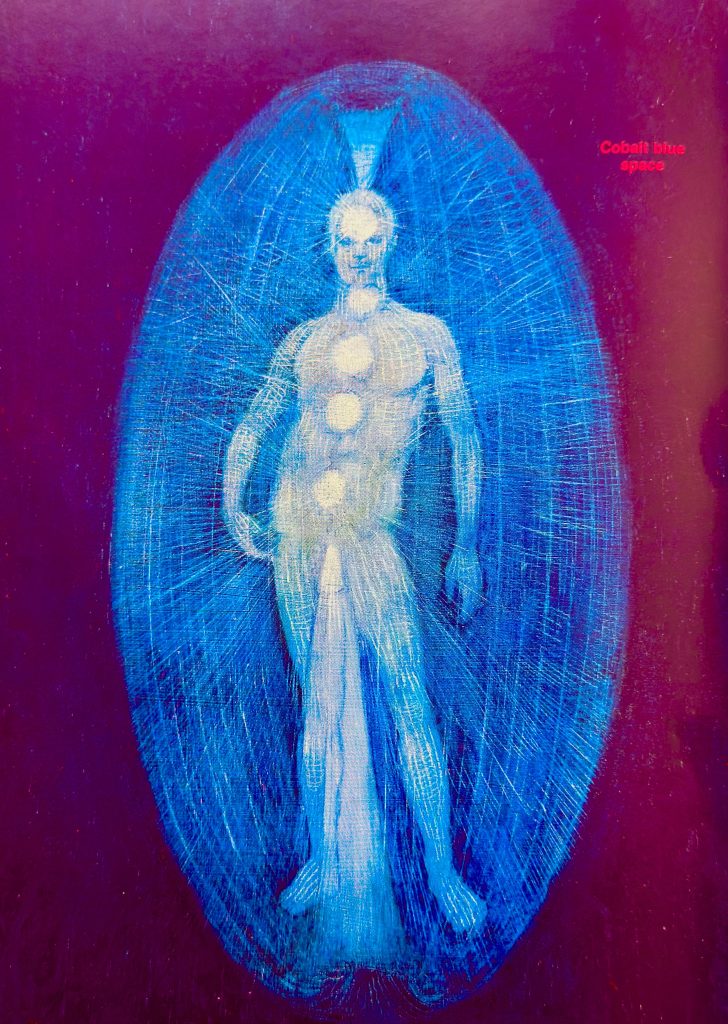 A scenic coastal road winding along rocky cliffs with a stunning ocean view under a partly cloudy sky.