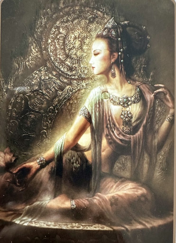 A scenic coastal road winding along rocky cliffs with a stunning ocean view under a partly cloudy sky.