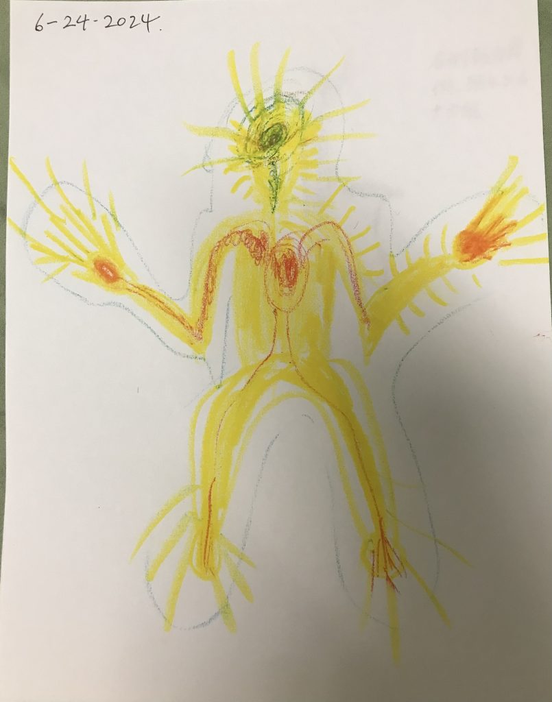 A scenic coastal road winding along rocky cliffs with a stunning ocean view under a partly cloudy sky.